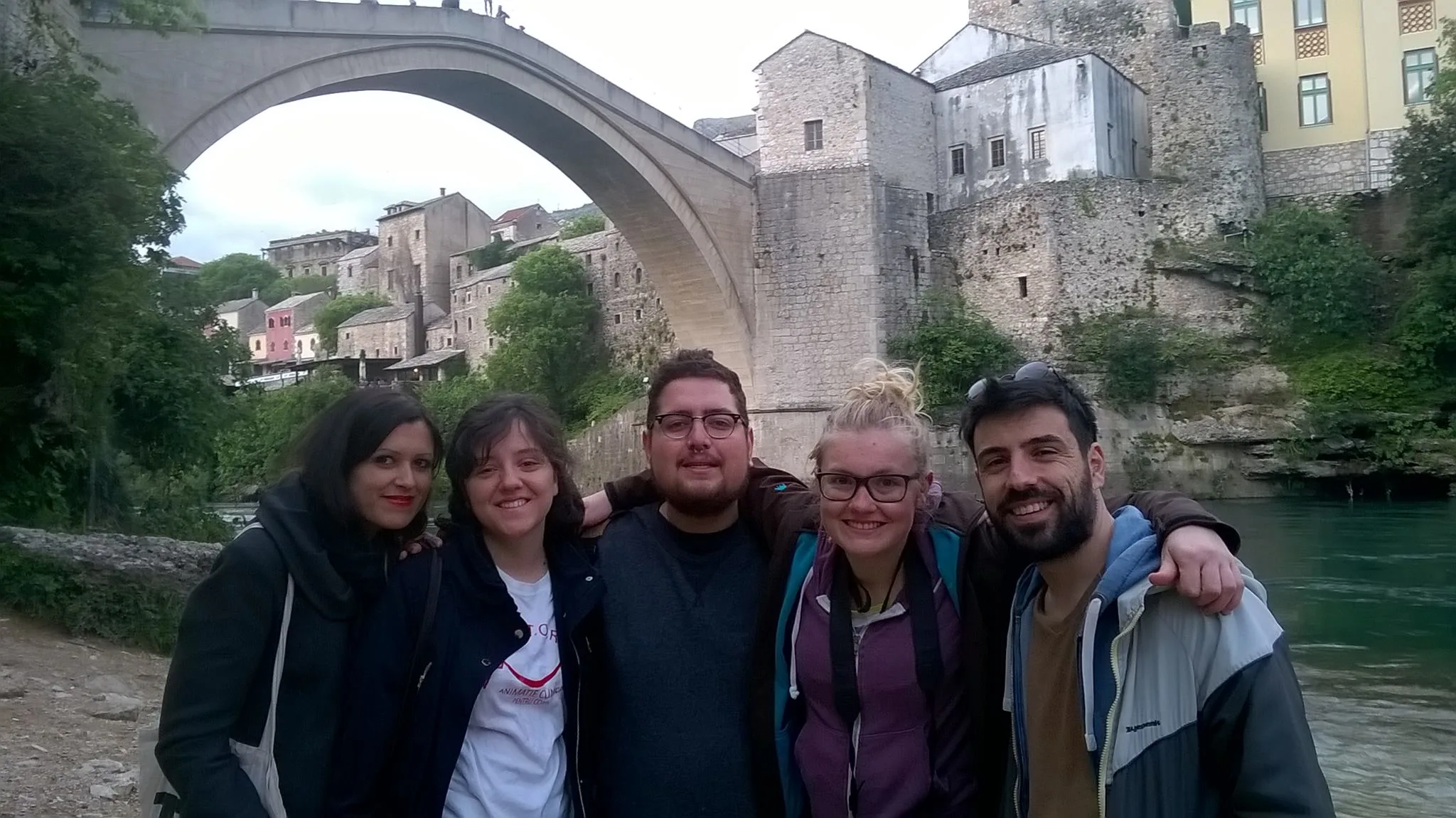 Large tour group at the Old Bridge of Mostar during free walking tour