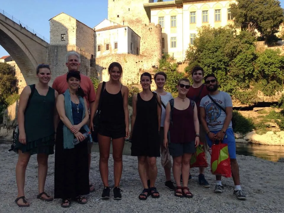 Travellers on the Old Bridge of Mostar during a walking tour