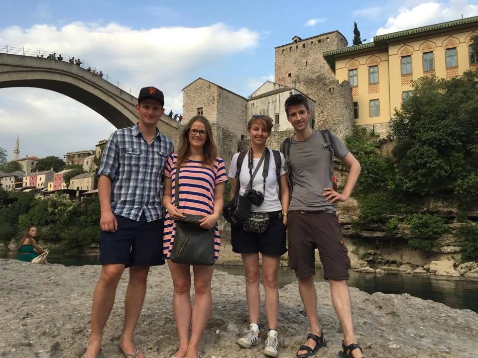 Walking tour group exploring Mostar's Ottoman architecture
