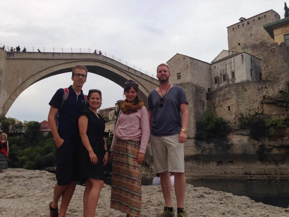 International tourists learning about Mostar war history