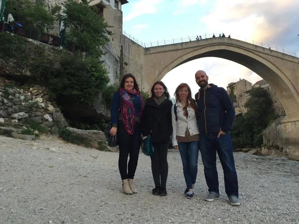 Tour group with guide at a historic Mostar site